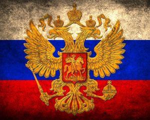The tri-color Russian flag and coat of arms. Photo Credit: http://www.1zoom.net