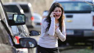 Carlee Soto tries to get information on her sister, Victoria Soto, a victim of the Sandy Hook shooting. (Photo Credit: AP Photo/Jessica Hill)