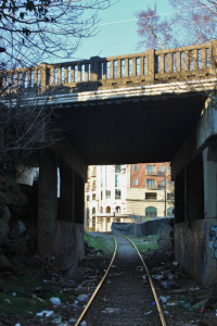 A view of 909 Broad’s entrance through a nearby railroad tunnel.