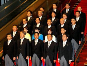 PM Shinzo Abe (first row, center) with his cabinet. Minister of Defense Tomomi Inada is in the second row, second from right. Credit: Japan Times